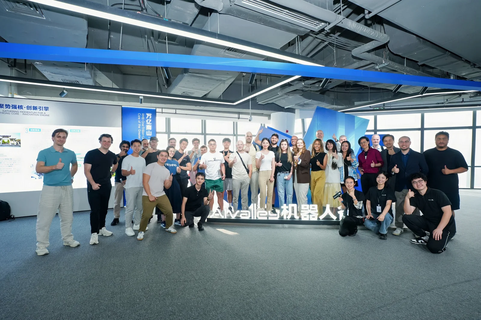 Visitors posing together at the Robot Valley showroom